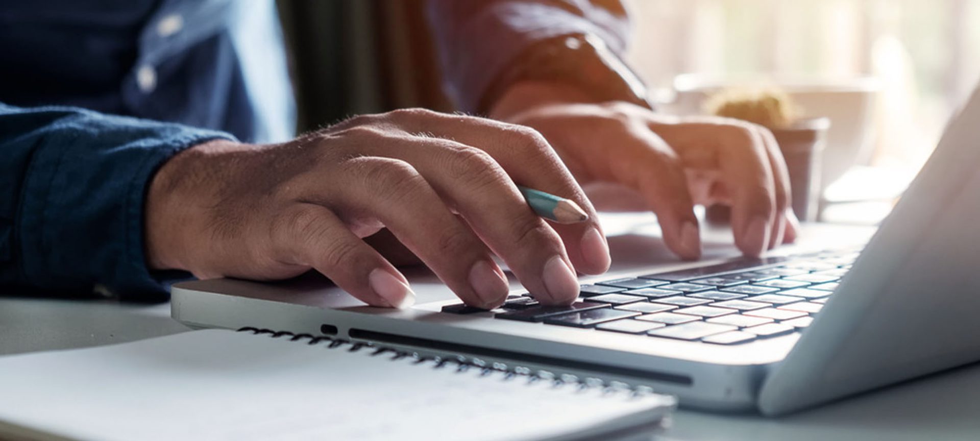 hands on a computer